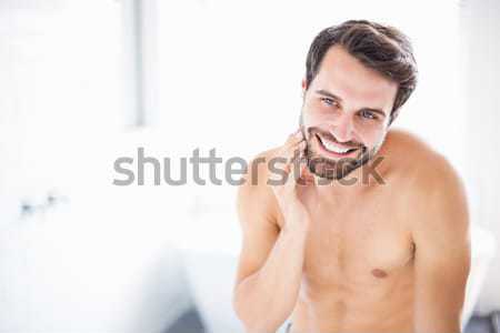 Smiling man in bed Stock photo © wavebreak_media