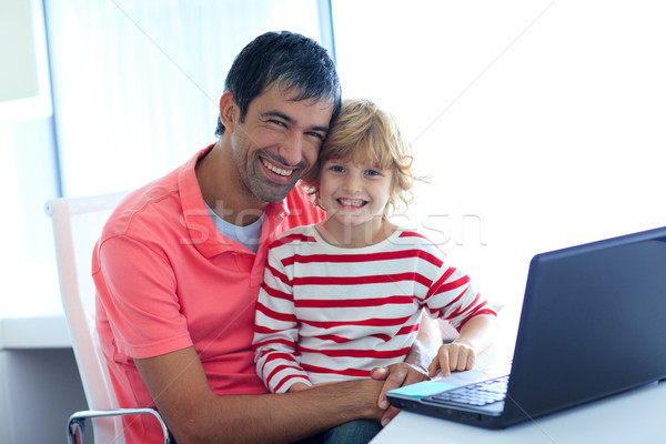 Father and son playing with a laptop Stock photo © wavebreak_media