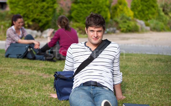 Good-looking male student lying on the grass with his schoolbag at his university campus Stock photo © wavebreak_media