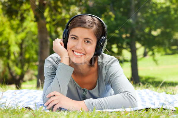 Woman listening to some music in the park Stock photo © wavebreak_media