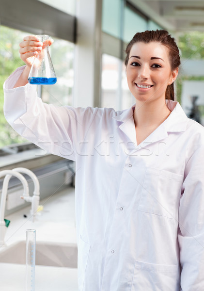 Portrait of a science student holding an Erlemeyer flask in a laboratory Stock photo © wavebreak_media