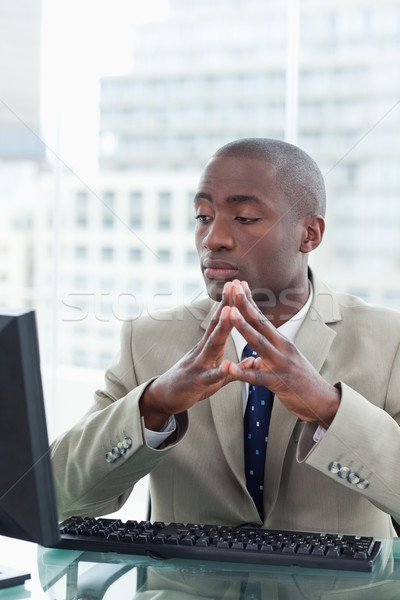 Portrait of a serious office worker using a computer in his office Stock photo © wavebreak_media