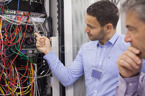 Technicians fixing wires in data center Stock photo © wavebreak_media