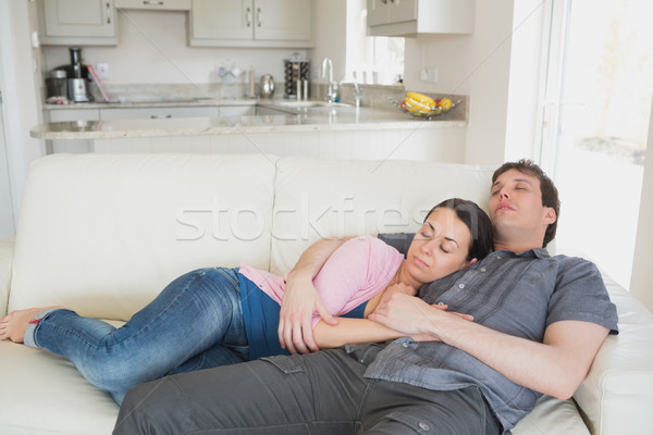 Two people lying on the couch in the living room while sleeping Stock photo © wavebreak_media