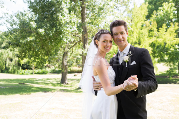 Loving newly wed couple dancing in garden Stock photo © wavebreak_media