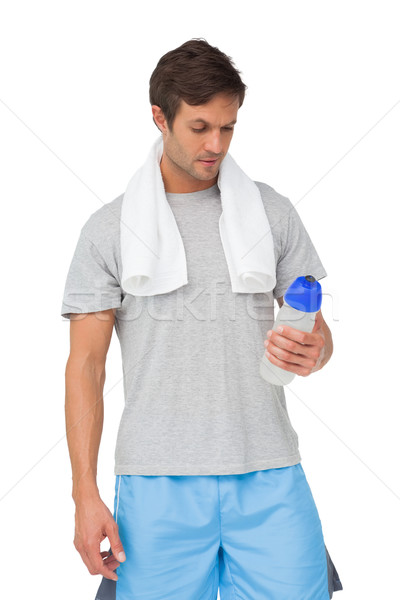 Dopasować młody człowiek manierka ręcznik stałego biały Zdjęcia stock © wavebreak_media