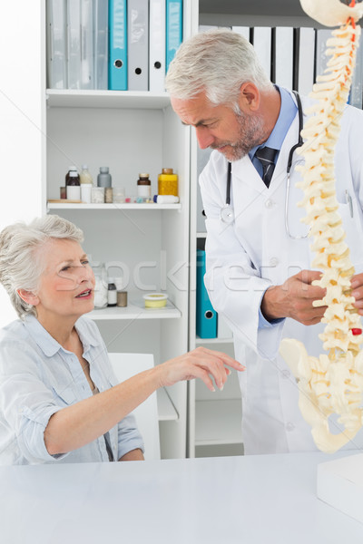 Male doctor explaining the spine to senior patient Stock photo © wavebreak_media