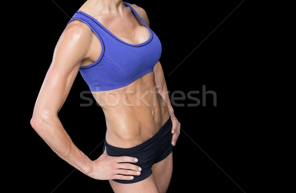 Fuerte mujer posando deportes sujetador shorts Foto stock © wavebreak_media