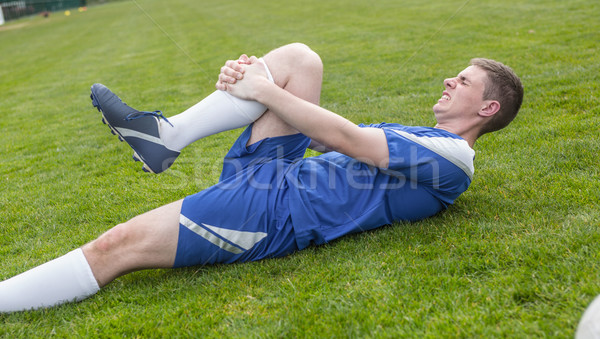 Voetballer Blauw gewond toonhoogte gras voetbal Stockfoto © wavebreak_media
