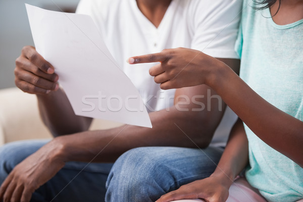 Couple sitting on their couch paying their bills Stock photo © wavebreak_media