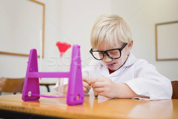 Cute pupil dressed up as scientist in classroom Stock photo © wavebreak_media
