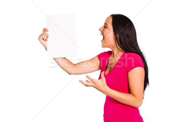 Angry woman shouting at piece of paper Stock photo © wavebreak_media