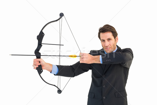 Serious businessman practicing archery looking at camera Stock photo © wavebreak_media