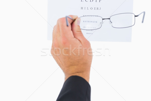 Man holding eyeglasses over paper  Stock photo © wavebreak_media