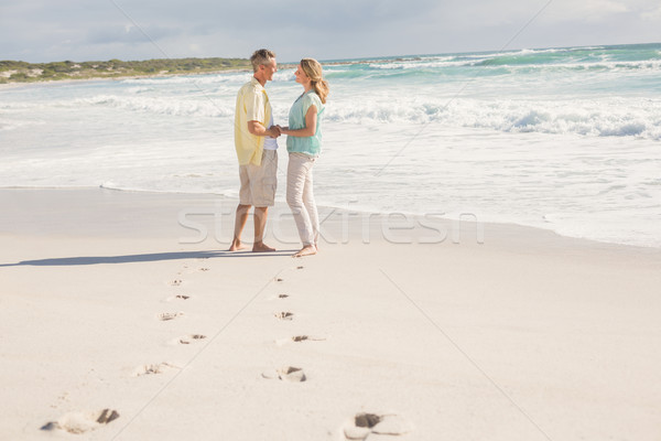 Gelukkig paar glimlachend ander strand zand Stockfoto © wavebreak_media