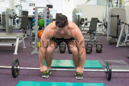 Composite image of muscular man lifting a kettlebell Stock photo © wavebreak_media