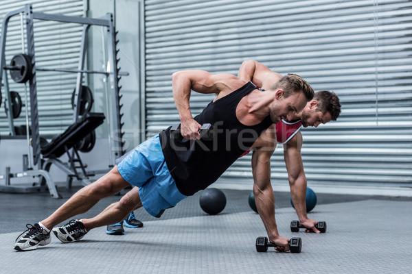 Muscular men doing a side plank Stock photo © wavebreak_media