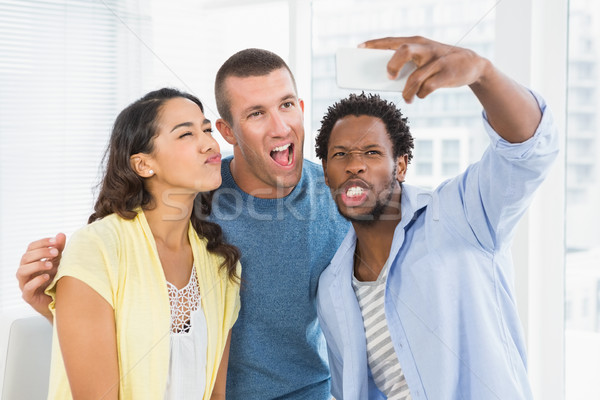 Colleagues taking selfies Stock photo © wavebreak_media