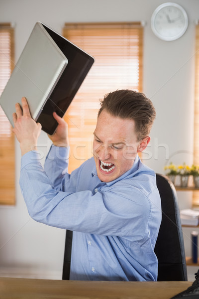 Furious businessman about to smash his laptop Stock photo © wavebreak_media