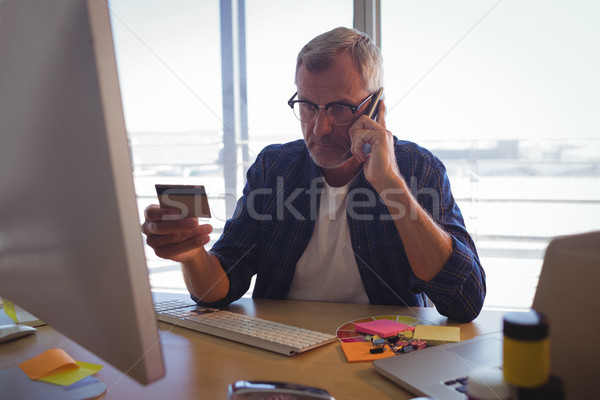 Işadamı konuşma cep telefonu kredi kartı ofis Stok fotoğraf © wavebreak_media