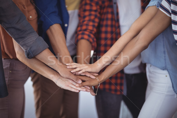 Mid section of business people stacking hands Stock photo © wavebreak_media