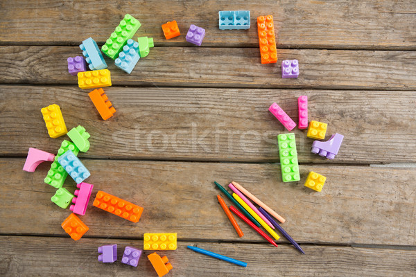 Overhead view of toy blocks with crayons on table Stock photo © wavebreak_media