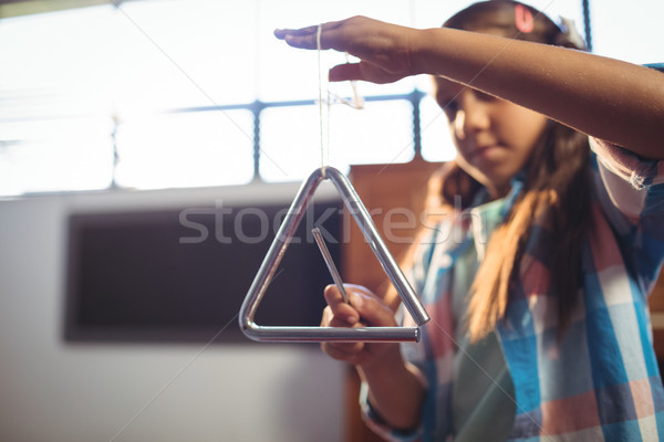 Lány játszik háromszög osztályterem zene iskola Stock fotó © wavebreak_media