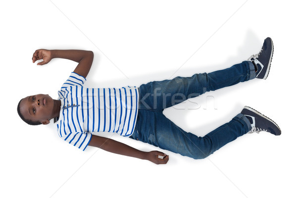 Boy lying on white background Stock photo © wavebreak_media