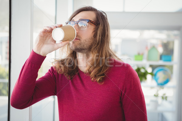 Hipster drinking coffee in office Stock photo © wavebreak_media