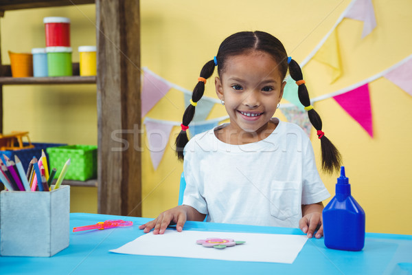 Smiling girl with her arts and crafts Stock photo © wavebreak_media