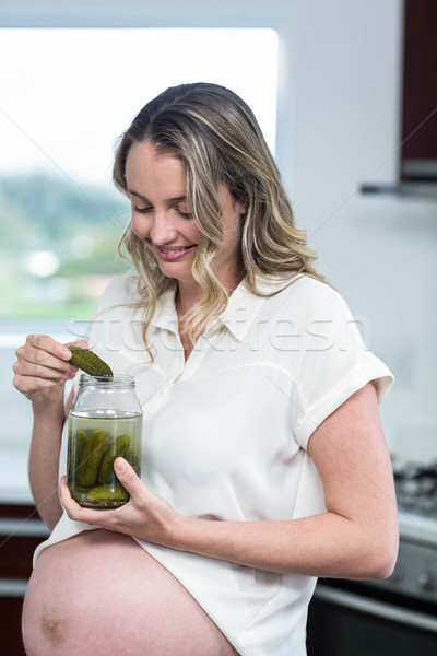 Pregnant woman eating gherkins Stock photo © wavebreak_media