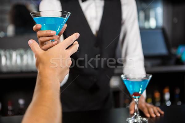 Barman bleu cocktail bar contre [[stock_photo]] © wavebreak_media