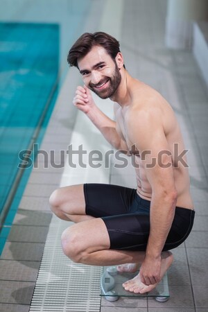 Man using a digital tablet near the pool Stock photo © wavebreak_media