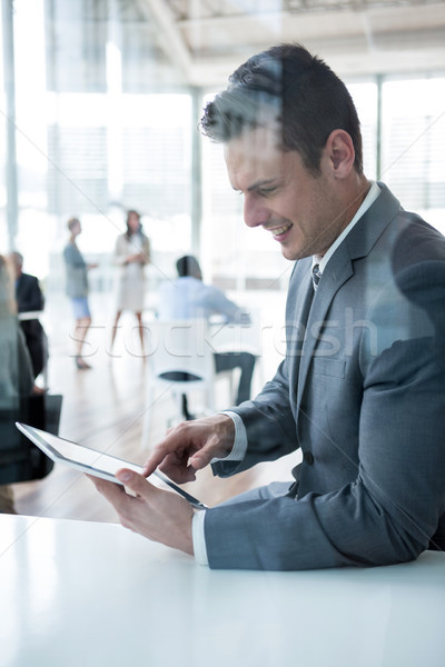 Businessman using digital tablet in the office Stock photo © wavebreak_media