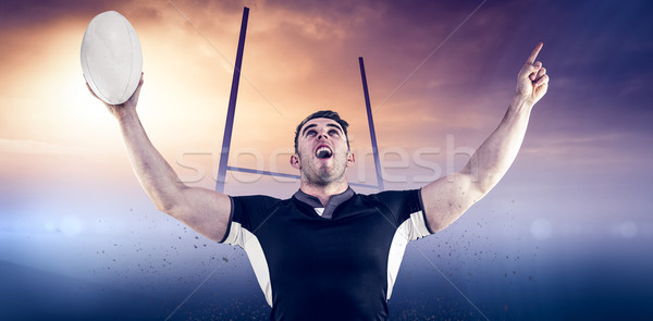 Composite image of rugby player cheering with the ball Stock photo © wavebreak_media