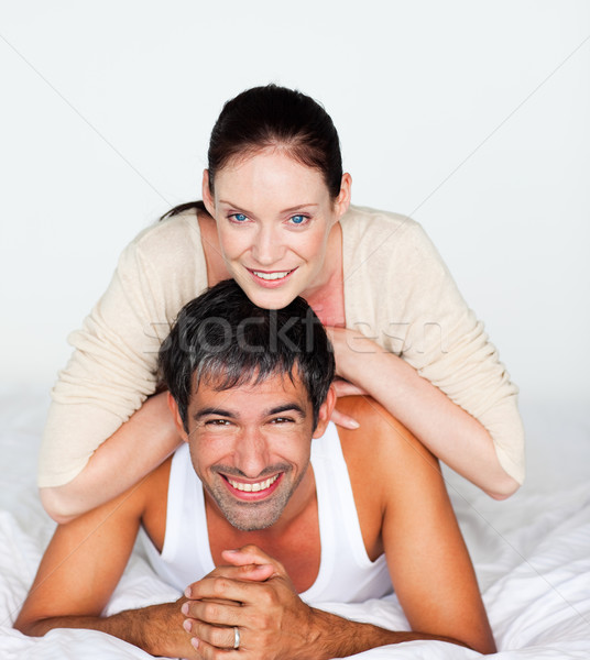 Alegre Pareja blanco cama mujer familia Foto stock © wavebreak_media