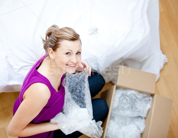 Delighted woman having a break between boxes Stock photo © wavebreak_media