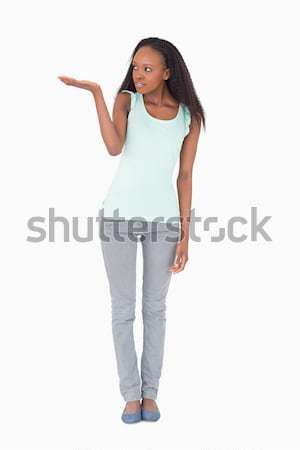 Smiling woman with one arm akimbo on white background Stock photo © wavebreak_media