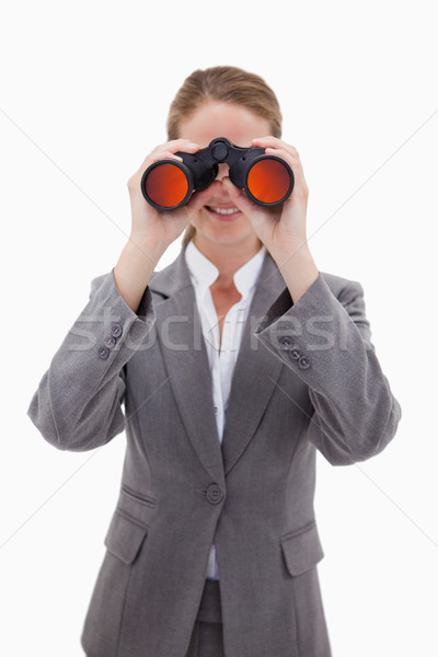 Bank employee looking through spyglasses against a white background Stock photo © wavebreak_media