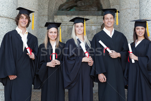 Zâmbitor prezinta universitar fată studenţi Imagine de stoc © wavebreak_media