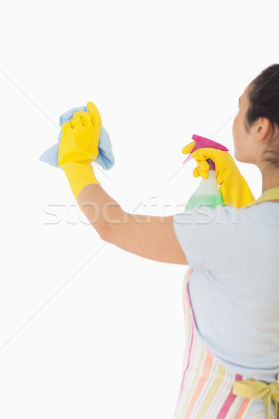 Woman cleaning wall with cloth and spray bottle Stock photo © wavebreak_media