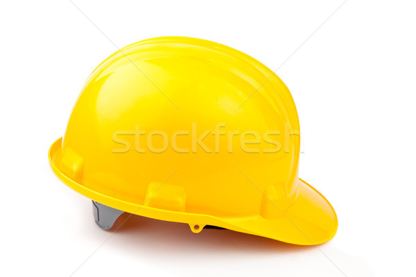Yellow helmet lying against white background Stock photo © wavebreak_media