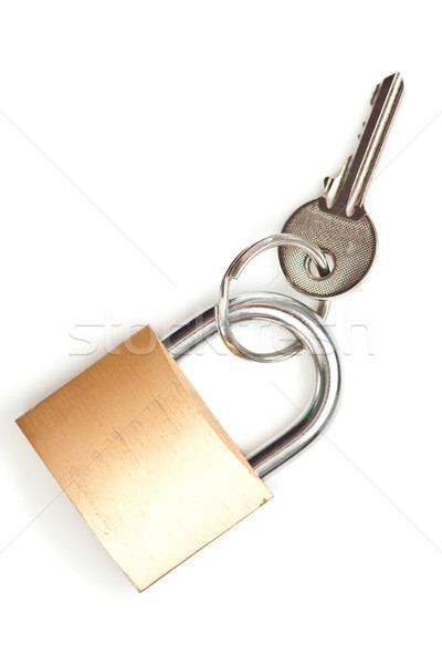 Stock photo: Key at lock against white background