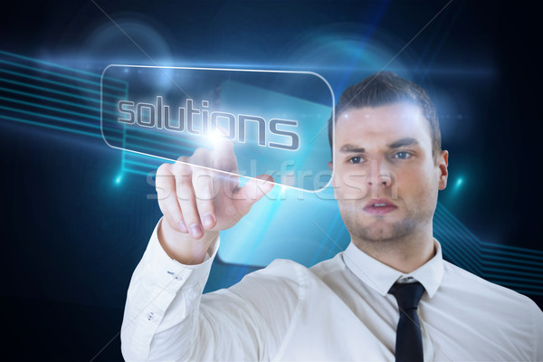 Stock photo: Businessman pointing to word solutions