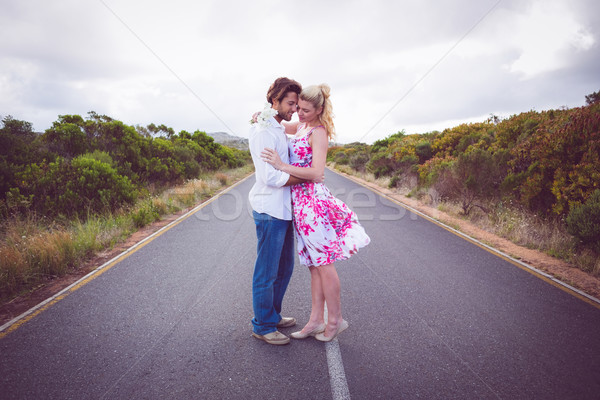 Cute couple standing on the road hugging Stock photo © wavebreak_media