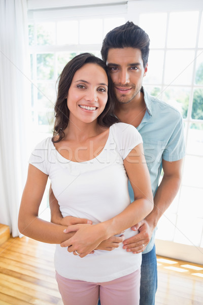 Stock photo: Attractive couple standing and hugging