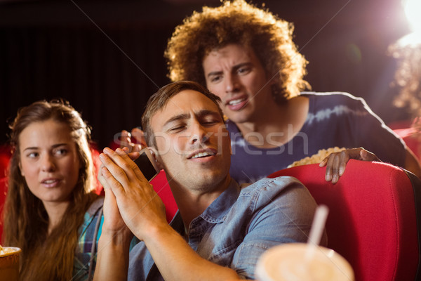 Annoying man on the phone during movie Stock photo © wavebreak_media