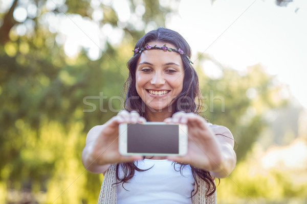 Pretty brunette taking a selfie Stock photo © wavebreak_media