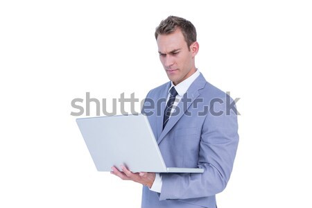 Bello imprenditore utilizzando il computer portatile computer bianco uomo Foto d'archivio © wavebreak_media