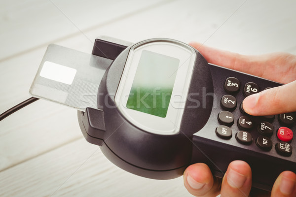 Man entering his pin on terminal Stock photo © wavebreak_media